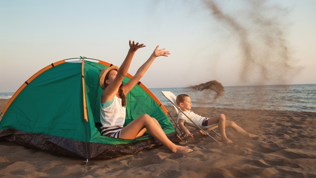 children playing on a beach off the beaten track in nz