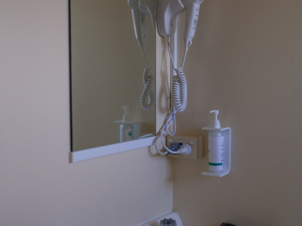 Bathroom vanity with mirror and hair dryer 