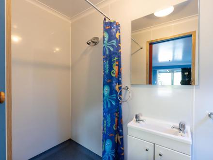 Self Contained Studio bathroom at Ahipara TOP 10 Holiday Park