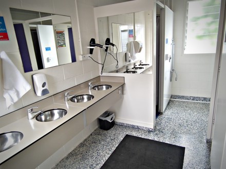 Line of sinks in communal bathroom