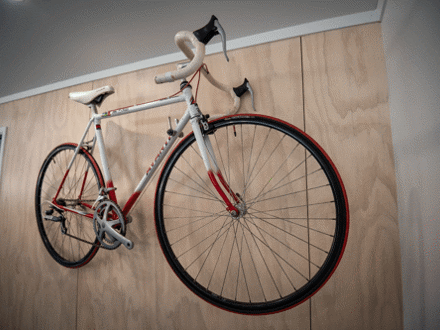 Road bike hanging up on wall