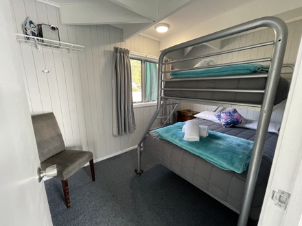Motutere Bay Deluxe Family Cabin Bedroom