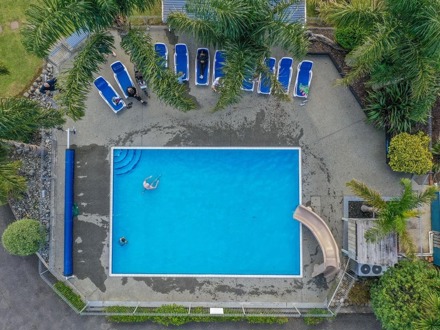 Ariel view of swimming pool and pool loungers