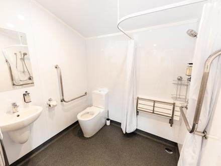 accessible bathroom in self-contained unit at Queenstown TOP 10