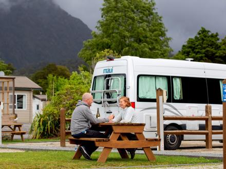 Couple in a campervan site 