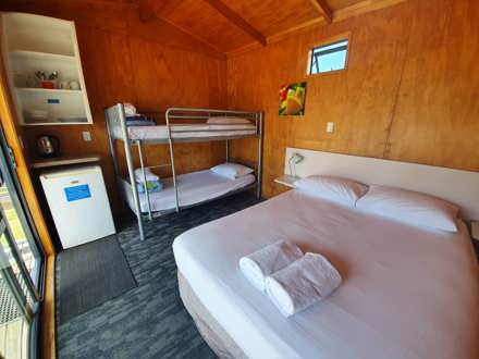 Cabin interior with double bed and bunk bed